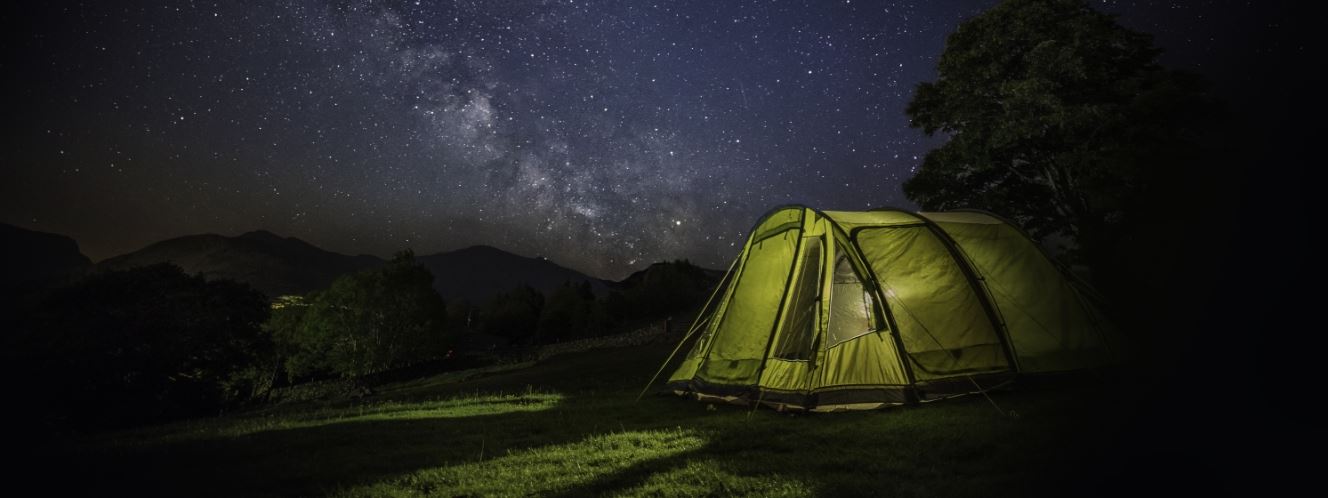 Tent at night with stars in the sky